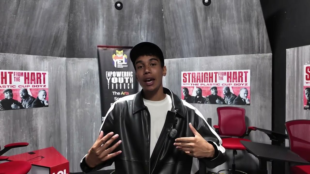 A young apprentice presenting to camera on a studio set